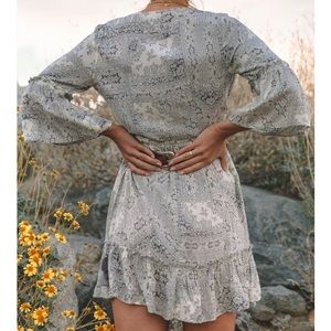 Gorgeous Lovestitch wrap dress. Belt not included. But has a tie with tassels.